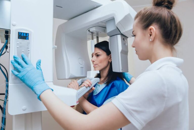 Dentist performing panoramic dental X-ray (OPG scan) to examine teeth and jaw structure