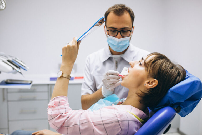 Dentist performing a regular dental check-up to maintain healthy teeth and a bright smile